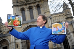 The Dean of Belfast, The Very Rev John Mann, with this year's Christmas stamps.